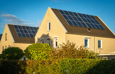 Solar panels on roofs on modern houses, largest photovoltaic neighbourhood of The Netherlands in...