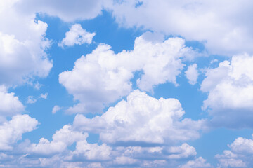 Obraz na płótnie Canvas Blue sky with white fluffy clouds background.