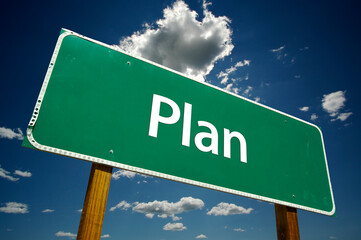 Plan Green Road Sign On Cloudy Blue Sky Background