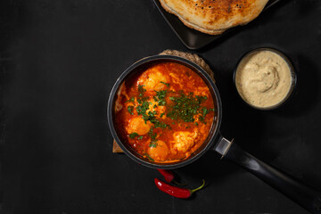 shakshuka on a dark background