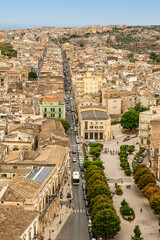 Naklejka premium aerial landscape of Scicli with beautiful historic buildings in the Baroque style at sunset