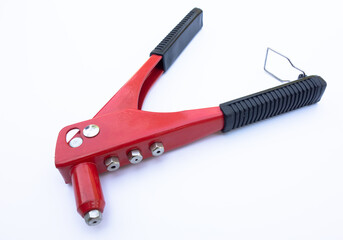 Hand tool for aluminum rivets. Traction rivet on white isolate.