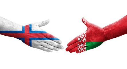 Handshake between Belarus and Faroe Islands flags painted on hands, isolated transparent image.