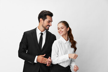 Man and woman smile with teeth business in business attire looking into camera on white isolated background. Stylish business concept paired between employees startup copy place