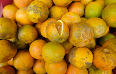 Orange fruit - large amounts of orange fruit, fresh orange fruit, orange fruit in a basket