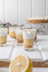 coffee appetizers in glass cups with cream, delicious desserts with elegant decoration, studio, pastry shop