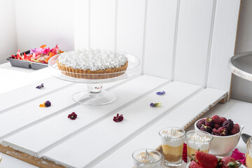 photography set of a traditional cake decorated with cream, delicious food with sugar, details of the pastry texture, studio