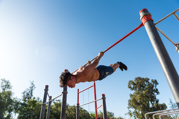 Fototapeta na wymiar sportsman doing outdoor gymnastics, athlete, calisthenics