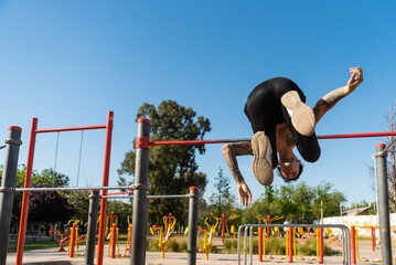 Fototapeta premium sportsman doing outdoor gymnastics, athlete, calisthenics
