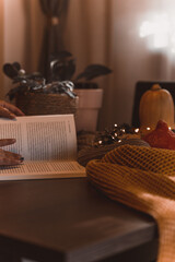 autumn photo on table with candles reading a book