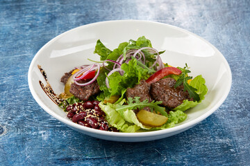 beef salad on the blue background