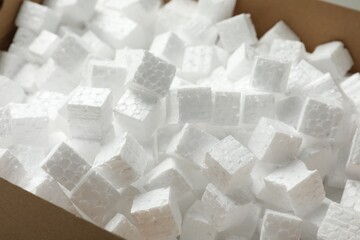 Closeup view of cardboard box with styrofoam cubes