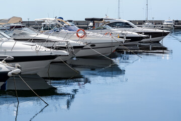 Beautiful view of city pier with moored boats on sunny day