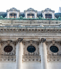 The inscription on the facade of the chamber of commerce building in the financial district of...