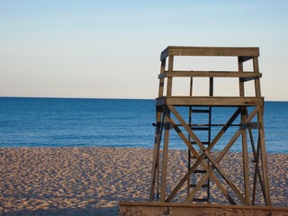 Empty lifeguard chair/stand, on empty beach at end of day, Martha's Vineyard