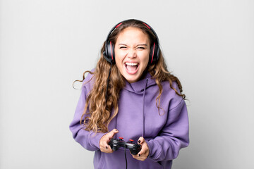 hispanic pretty young woman playing a game with headphones and a control. gamer concept