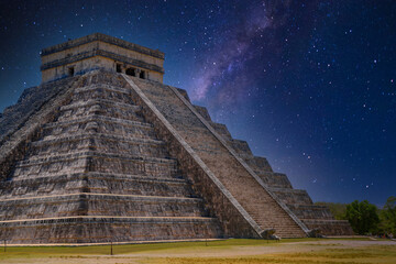 Temple Pyramid of Kukulcan El Castillo with Milky Way Galaxy stars night sky, Chichen Itza,...