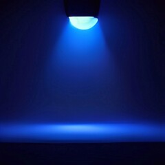 Fototapeta na wymiar Blue spotlight on dark room for mockup products presentation 