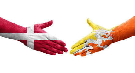 Handshake between Bhutan and Denmark flags painted on hands, isolated transparent image.