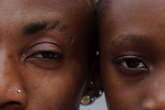 Close up eye to eye image of father and son's face