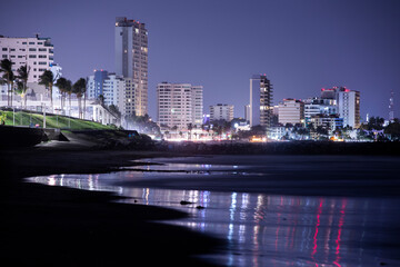 Fototapeta na wymiar Night time view of the beach front and skyline of Boca Del Rio, Veracruz, Mexico.