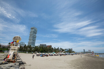 Daytime view of a warm summer day at a skyline framed beach at Boca del Rio, Veracruz, Mexico.