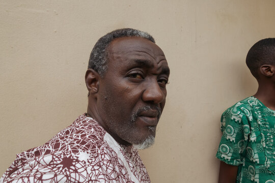 Nigerian father in his late 50s wearing native attire 