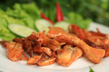 Orange Salmon Belly that has been fried and used to make food