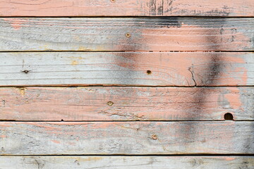 White old weathered wooden planks wall as background, grunge texture pattern with scratches and paint peel off details