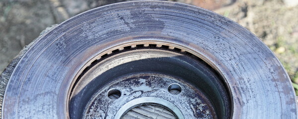 Ring abrasion stripes on used ventilated brake disc surface fragment close up