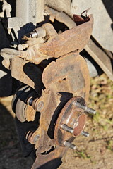 Old grinded hub on rusty steering knuckle before car brake disc mounting