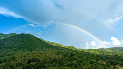 Rainbow on Sky in the mountains, Panorama of flying in a Nature rainbow in the rain, aerial view of...