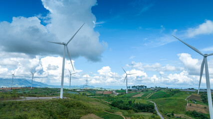 Wind Turbines Windmill Energy Farm, Windmill on blue sky puffy clouds
Alternative energy sources. Renewable electric sustainable nature energy technology. 
