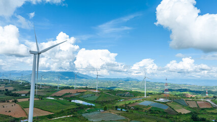 Wind Turbines Windmill Energy Farm, Windmill on blue sky puffy clouds
Alternative energy sources....