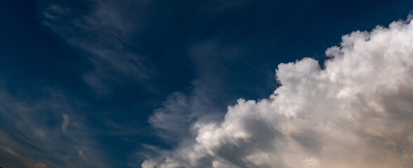 expressive clouds in a dark blue sky