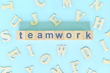 Teamwork core values concept in business, company and organization. Word typography on wooden blocks flat lay.