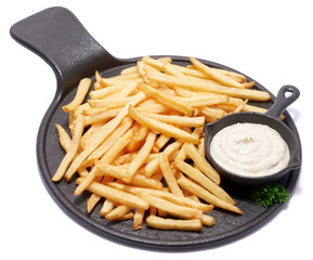 French fries potatoes on black ceramic serving board or dish isolated on white background