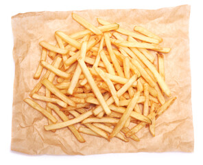 French fries potatoes on parchment paper isolated on white background