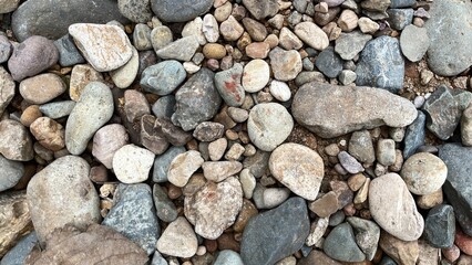 Light brown rock texture. Rough mountain surface. Close-up. Beige stone background with space for design. Web banner. Wide. Panoramic. Sandstone. Solid, rocky, slate.