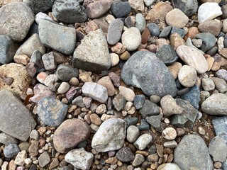 Light brown rock texture. Rough mountain surface. Close-up. Beige stone background with space for design. Web banner. Wide. Panoramic. Sandstone. Solid, rocky, slate.