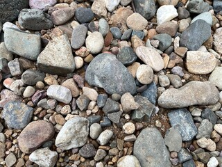 Light brown rock texture. Rough mountain surface. Close-up. Beige stone background with space for design. Web banner. Wide. Panoramic. Sandstone. Solid, rocky, slate.