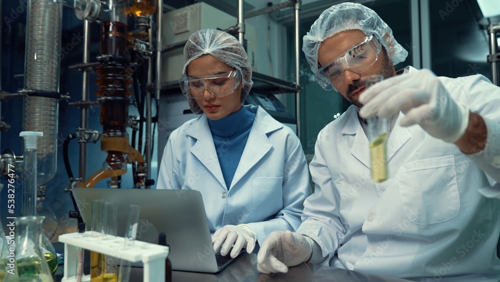 Poster two scientist in professional uniform working in laboratory for chemical and biomedical experiment
