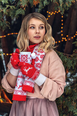 New Year's photos of a beautiful girl in the forest with a decorated Christmas tree, filled with comfort and magic