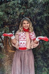 New Year's photos of a beautiful girl in the forest with a decorated Christmas tree, filled with comfort and magic