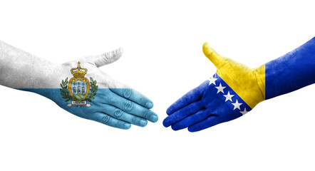 Handshake between Bosnia and San Marino flags painted on hands, isolated transparent image.