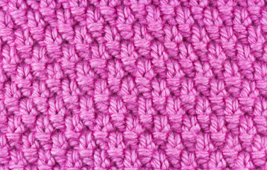 Close-up view of pink thread yarn background