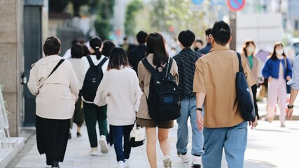 Crowd of younger people walking in Tokyo, Japan	
