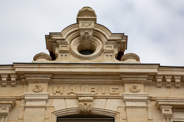 mairie france text sign on wall facade building mean town hall in center city france