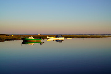 Sunrise sunset harbor hut boat at the port of Ares on the Bassin Arcachon in Gironde France