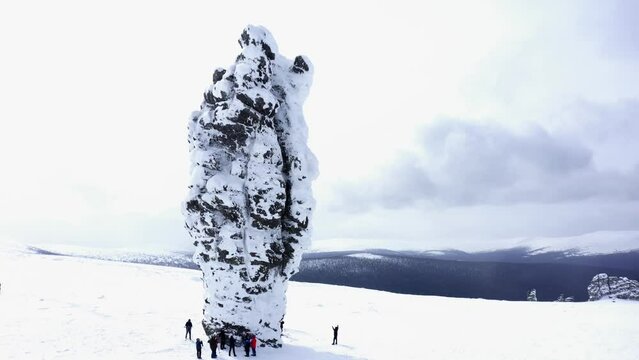 A group of tourists on Man-Pupuner, or Pillars of weathering (Mansi blockheads) - a geological monument, on the territory of the Pechoro-Ilychsky reserve on Mount Man-Pupu-ner "small mountain of idols